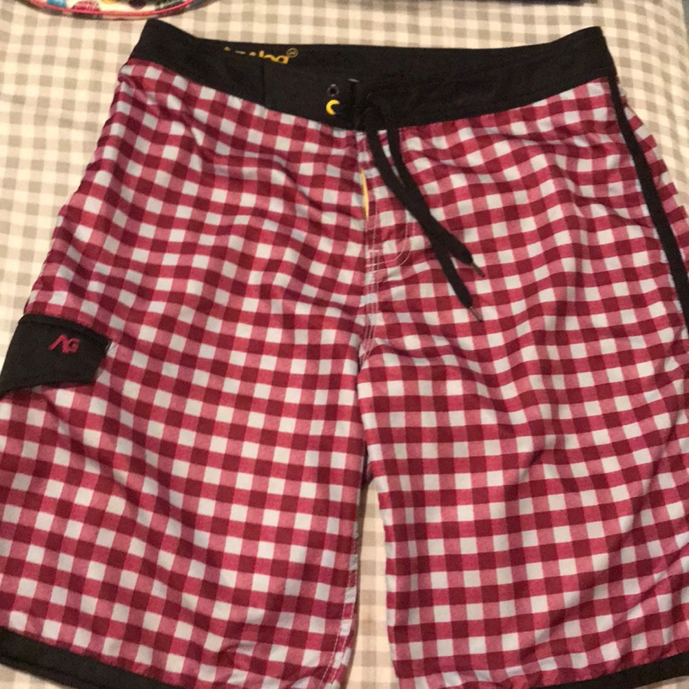 Men’s board 100% polyester shorts.  Size 34.
